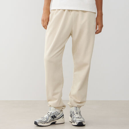 NEW BALANCE PANT JOGGER SMALL LOGO FT BEIGE/BLANCO HOMBRE