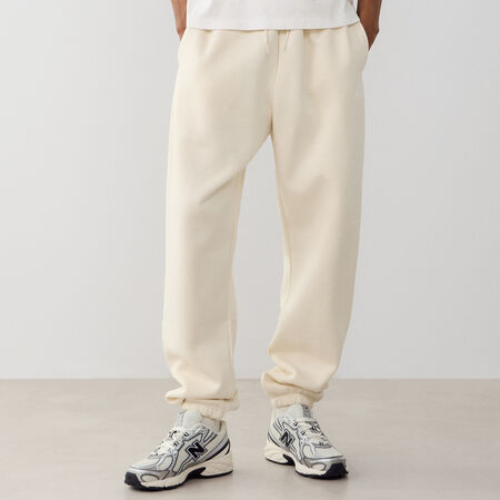 NEW BALANCE PANT JOGGER SMALL LOGO BEIGE HOMBRE