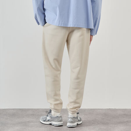 NEW BALANCE PANT JOGGER SMALL LOGO BEIGE HOMBRE