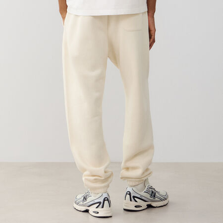 NEW BALANCE PANT JOGGER SMALL LOGO BEIGE HOMBRE