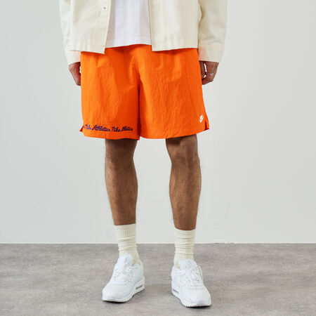 NIKE SHORT CLUB FLOW VARSITY NARANJA HOMBRE